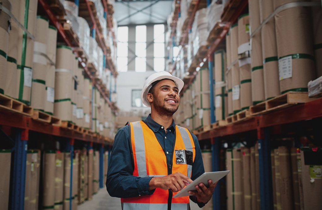 Male Worker Warehouse Scrolling on Tablet